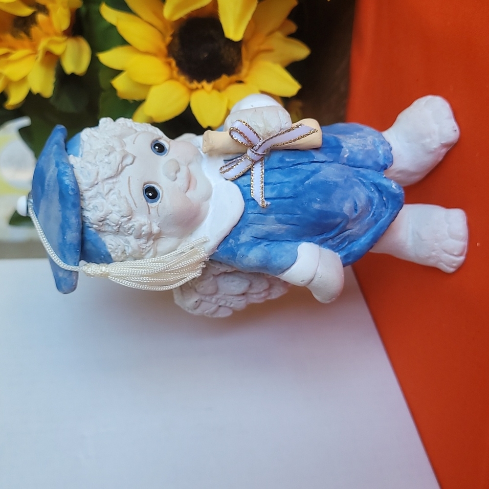 Graduation figurine, angel wings, hat with tassle New condition!